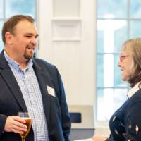 Guests chat before the dinner